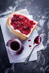 Bread with Homemade Raspberry Jam on Dark Background Table