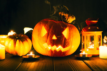 Jack O Lantern Halloween Pumpkin with Candle Light Inside and Smoke Around, Toned Image