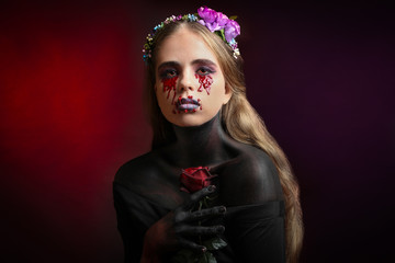 Beautiful girl with creative make-up for the Halloween party