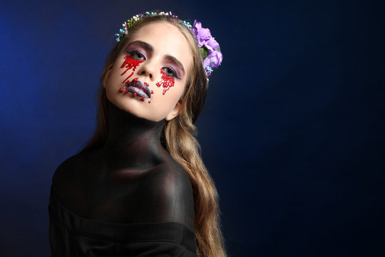 
Beautiful girl with creative make-up for the Halloween party