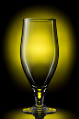 empty beer glass on a color background