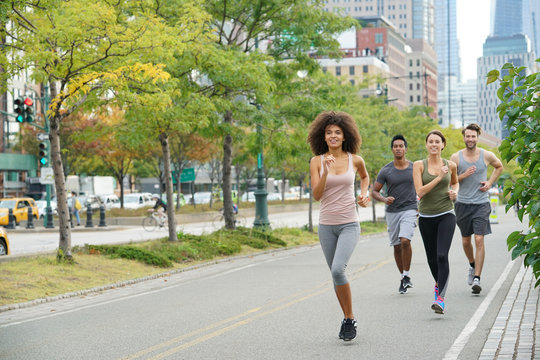 Group of joggers exercising in Manhattan running track