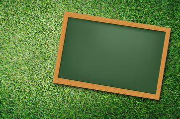 Green Blackboard on green field