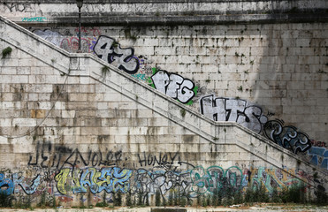 Descent to the Tiber, painted with graffiti. Rome, Italy
