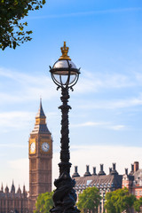 Fototapeta na wymiar Old Style London View / Vintage street lamp in London with Big Ben clock tower and rooftops of houses