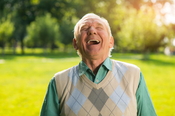 Elderly man laughing. Senior male on nature background. Wonderful mood every day. Can't restrain...
