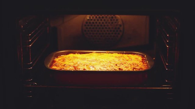 Baked lasagna in the oven. Open the oven check the preparing and close. 1920x1080