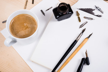 Paper, ink and calligraphy pens. Lettering workshop details