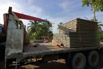 Stack of prestressed concrete slabs loaded on truck for construction