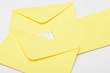 yellow letter envelopes on white backgrounds