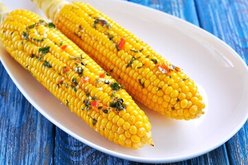 Corn baked in foil with butter, garlic, chili, coriander and sea salt.