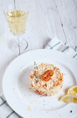 Risotto with shrimp and glass of white wine
