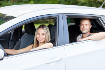 Young people enjoying a roadtrip in the car