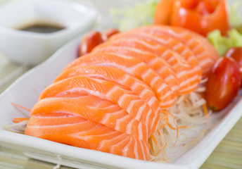 Sashimi salmon with wasabi on wooden table japanese food