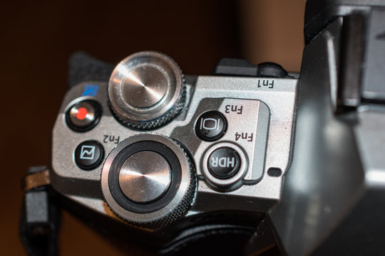 knobs and buttons on a digital camera