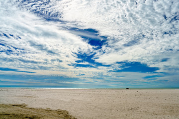Swirling Clouds over a beach