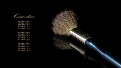 Makeup brush on professional cosmetic isolated on black backgrou