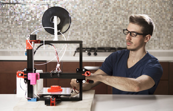 student with 3D printer