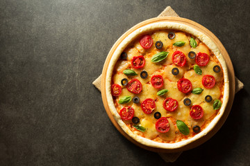 italian pizza at black background