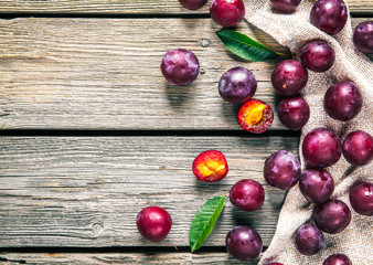 Fresh plums with leaves