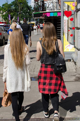 Two girlfriends are walking 