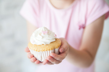 Cupcake in a girl's hands