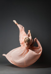 Woman dancing in light dress