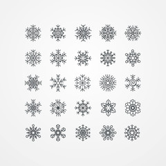Fototapeta na wymiar Collection of black snowflakes on a white background