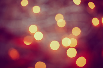 Obraz premium Metal Jingle Bells and Christmas Garland Light on wooden background.