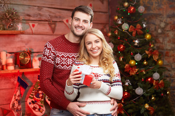 Young couple celebrating Christmas at home