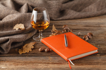 Autumn drinking time with alcohol glass