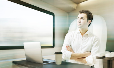 Man travelling in train compartment