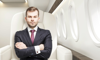 Man in business class of a plane