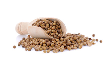 coriander seed in wooden scoop isolated on white background