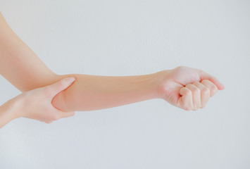 soft focus on hand of woman feel elbow pain that are sign of Rhe