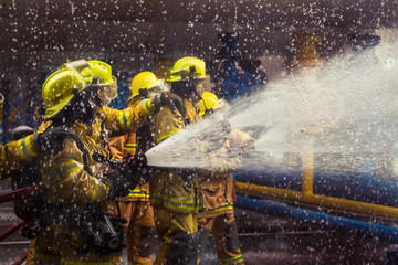 Firefighters training, foreground is drop of water springer, Sel