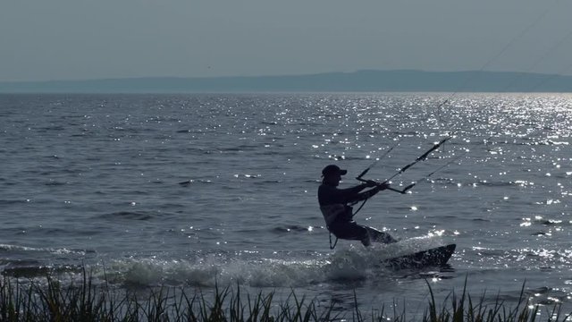 kitesurfer enjoy kitesurfing in sundown.