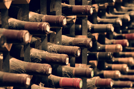 Bottles Of Wine Aging In An Underground Cellar