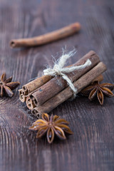 cinnamon and star anise on a wooden background . close-up