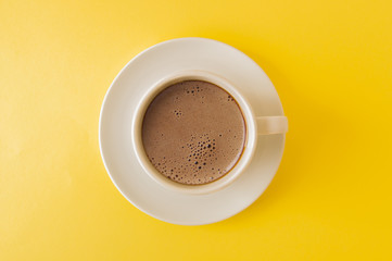 Latte art coffee, yellow color background