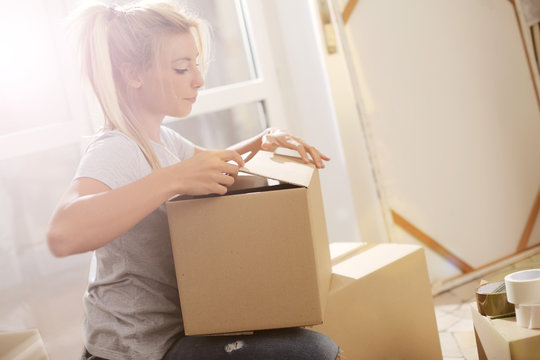Young woman moving to her new home