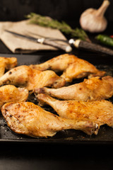 Fried chicken legs with spices, herbs and rosemary