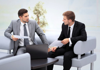 Business people Having Meeting Around Table In Modern Office