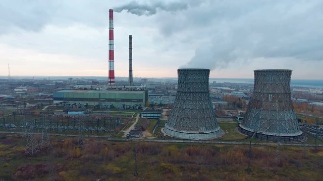 Aerial view of power plants, thermal power station. Smoking pipe at industrial area. 4K.