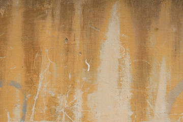 Wall fragment with scratches and cracks