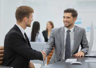 Business man shaking hand to partner