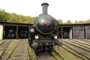 Fototapeta premium Old Vintage Steam Locomotive At The Train Depot 