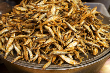 Broiled anchovy, fried fish. Street food