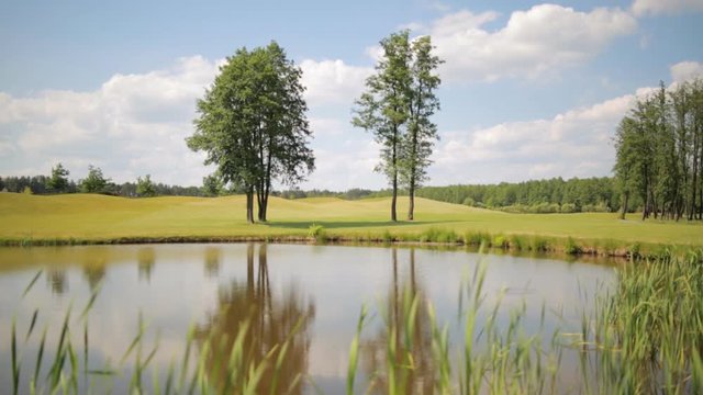 Beautiful landscape of pond on the golf field