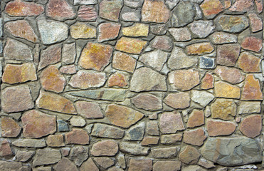 wall of granite boulders of different colors